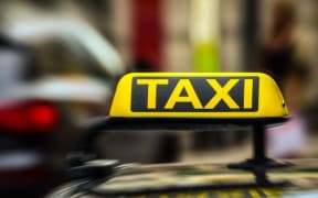 taxi sign on car