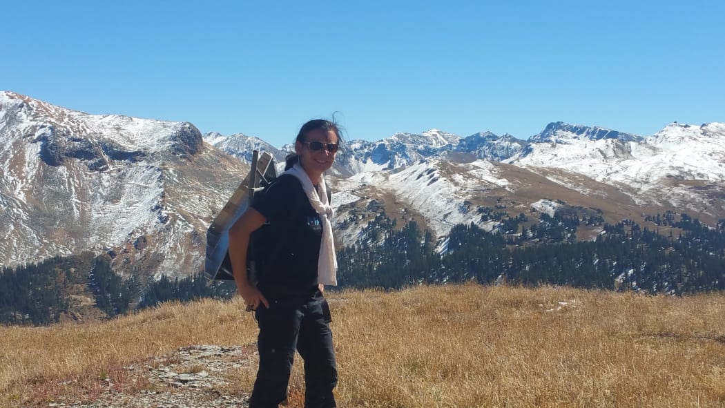 Dr Delwyn Moller, carrying a corner reflector into the San Juan Mountains in Colorado, USA for radar calibration during a NASA airborne snow measurement campaign.