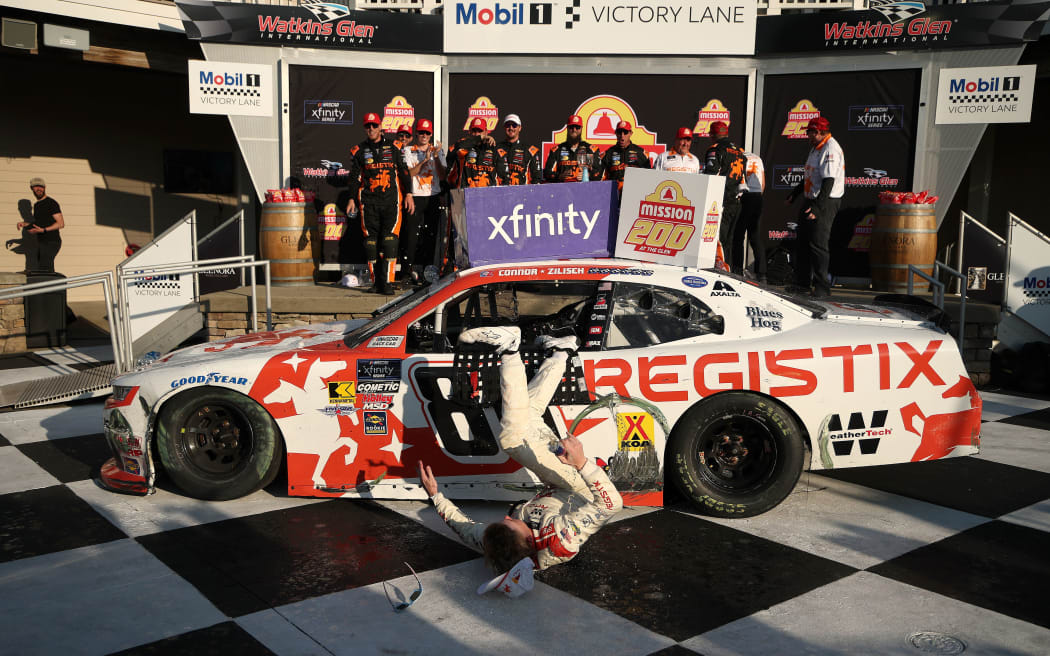 Connor Zilisch slips and falls off his car after winning the NASCAR Xfinity Series' latest race.