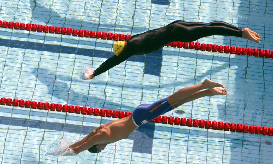Ian Thorpe from Australia and Pieter van den Hoogenband from Netherlands compete during the Men's 200m freestyle, heat 8, at the 2004 Olympic Games in Athens.