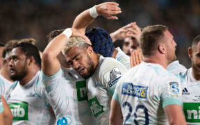 Blues No.8 Hoskins Sotutu and the Blues celebrate.