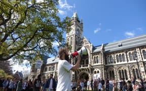Otago University Students' Association recreation officer Josh Smythe leads the protest against the proctor's activities.