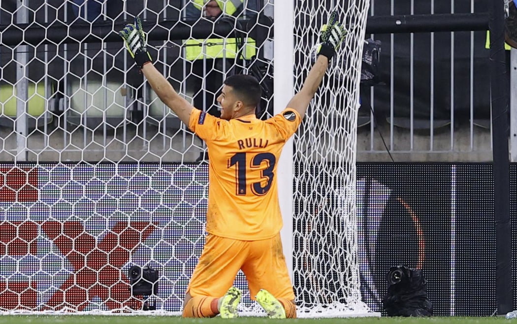 Villarreal's Argentine goalkeeper Geronimo Rulli reacts after deflecting a shot by Manchester United's Spanish goalkeeper David de Gea in the penalty shootout during the UEFA Europa League final football at the Gdansk Stadium on May 26, 2021.