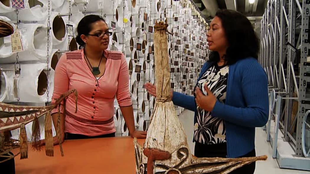 Togialelei Dr Safua Akeli Amaama (R) talking with Te Papa colleague in collections storage.