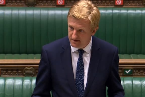 A video grab from footage broadcast by the UK Parliament's Parliamentary Recording Unit (PRU) shows Britain's Culture Secretary Oliver Dowden as he gives a statement to the House of Commons in London on July 14, 2020, on UK telecommunications.