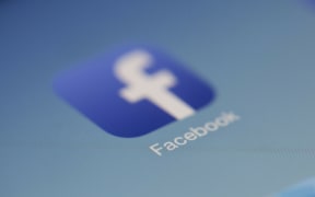 Facebook logo seen on a screen