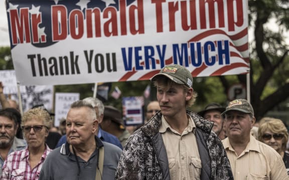 White South Africans supporting US President Donald Trump and South African and US tech billionaire Elon Musk gather in front of the US Embassy in Pretoria, on February 15, 2025 for a demonstration. Trump and Pretoria are locked in a diplomatic row over a land expropriation act that Washington says will lead to the takeover of white-owned farms.
Trump, whose tycoon ally Elon Musk was born in South Africa, said on February 7, 2025 the law signed in January would "enable the government of South Africa to seize ethnic minority Afrikaners' agricultural property without compensation".
It allows the government, as a matter of public interest, to decide on expropriations without compensation -- but only in exceptional circumstances. (Photo by MARCO LONGARI / AFP)