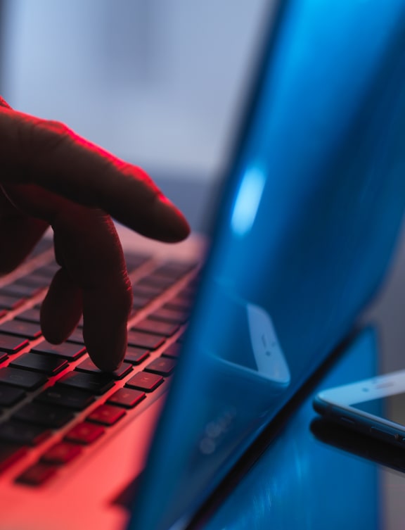 A hand enters account details on a laptop (file)
