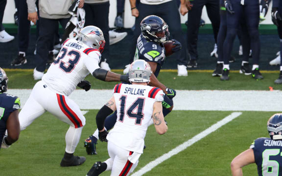 Seattle Seahawks’ running back #09 Kenneth Walker III runs with the ball during Super Bowl LX between the New England Patriots and the Seattle Seahawks at Levi's Stadium in Santa Clara, California on February 8, 2026. (Photo by Patrick T. Fallon / AFP)