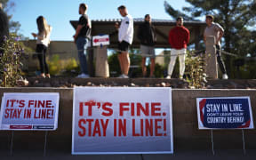 SCOTTSDALE, ARIZONA - NOVEMBER 05: Voters wait in line to cast their ballots at a polling place on November 05, 2024 in Scottsdale, Arizona. Americans cast their ballots today in the presidential race between Republican nominee, former President Donald Trump and Democratic nominee, Vice President Kamala Harris, as well as multiple state elections that will determine the balance of power in Congress.   Mario Tama/Getty Images/AFP (Photo by MARIO TAMA / GETTY IMAGES NORTH AMERICA / Getty Images via AFP)