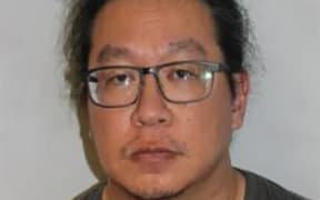 This undated handout photo received by AFP from London's Metropolitan Police on February 12, 2026 shows former nursery care worker Vincent Chan in custody in London. The UK nursery worker will be sentenced later on February 12 for years of child sexual abuse, as the government considers making CCTV mandatory in nurseries after a string of similar cases. Chan is facing years in prison after he admitted to 56 counts of abuse, including molesting four girls aged three and four at a north London nursery, between 2022 and 2024. (Photo by Handout / Metropolitan Police / AFP) / - NO Marketing campaign / - NO MARKETING CAMPAIGN / -----EDITORS NOTE --- RESTRICTED TO EDITORIAL USE - MANDATORY CREDIT "AFP PHOTO /  METROPOLITAN POLICE" - NO MARKETING - NO ADVERTISING CAMPAIGNS - DISTRIBUTED AS A SERVICE TO CLIENTS