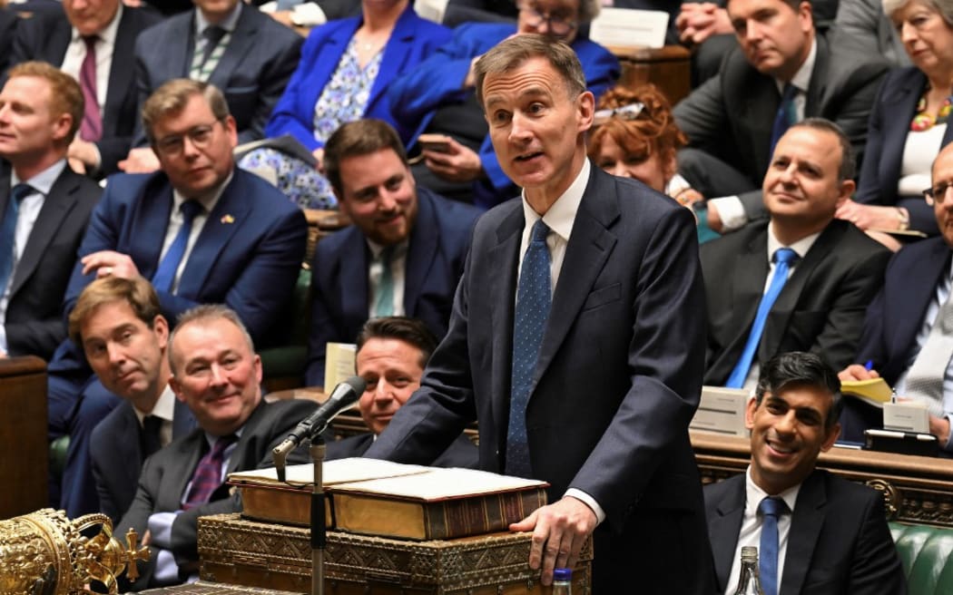 Britain's Chancellor of the Exchequer Jeremy Hunt presenting his Autumn Budget Statement at the House of Commons, in London, on November 22, 2023.