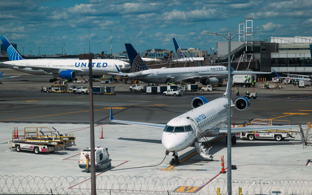 NEWARK, NEW JERSEY - JUNE 02: Planes sit on the tarmac at Newark Liberty International Airport following a news conference by Transportation Secretary Sean Duffy at the airport, where he announced the reopening of a major runway at the airport, nearly two weeks ahead of schedule on June 02, 2025 in Newark, New Jersey. Delays and cancellations have plagued Newark, one of the nation's busiest airports, for months. Air traffic control outages, runway construction, and an announcement by United Airlines that over 20% of FAA controllers at Newark walked off the job have all contributed to the delays.   Spencer Platt/Getty Images/AFP (Photo by SPENCER PLATT / GETTY IMAGES NORTH AMERICA / Getty Images via AFP)