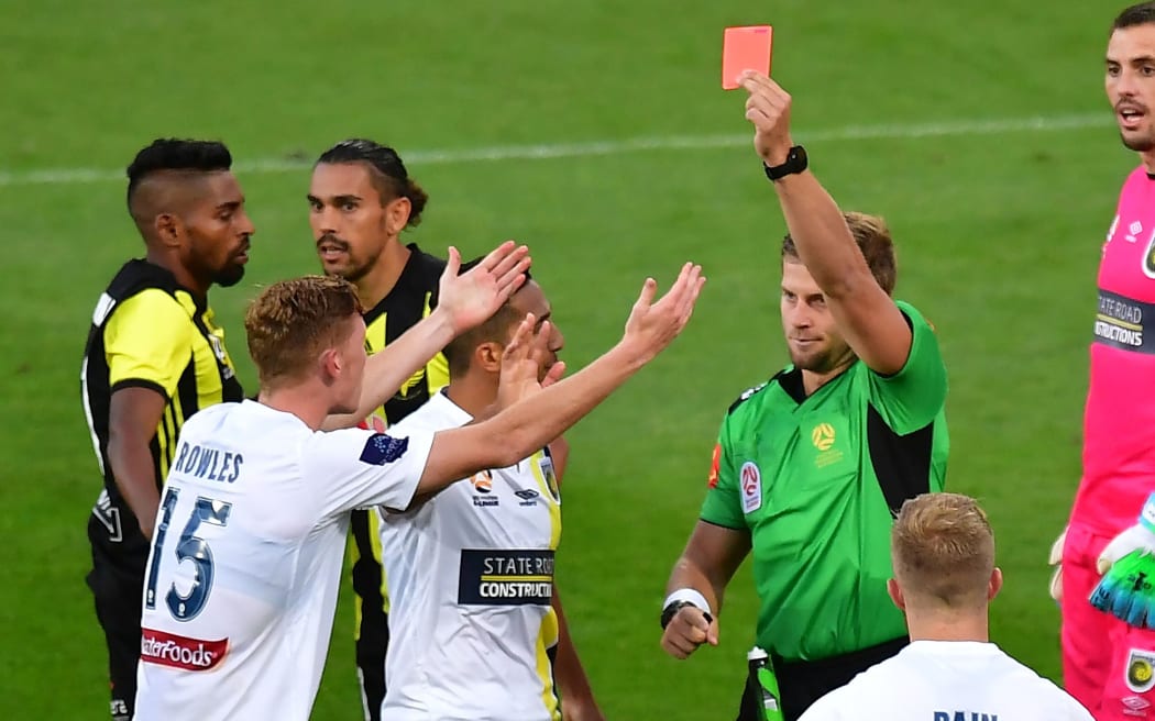 Mariners' Kye Rowles (L) is red carded during the A-League game against Phoenix.