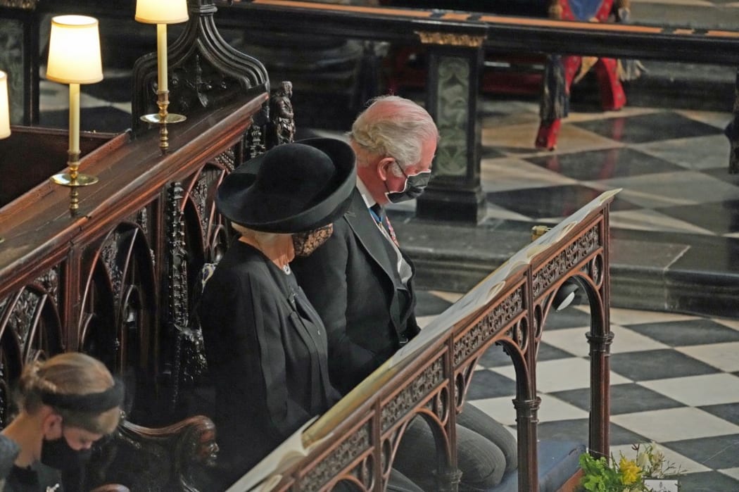 Britain's Camilla, Duchess of Cornwall and Britain's Prince Charles, Prince of Wales attend the funeral service of Britain's Prince Philip, Duke of Edinburgh inside St George's Chapel in Windsor Castle in Windsor, west of London, on April 17, 2021.