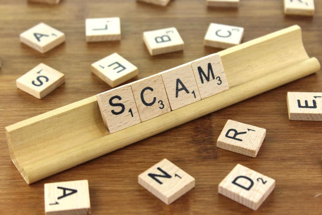 Scam spelled in scrabble