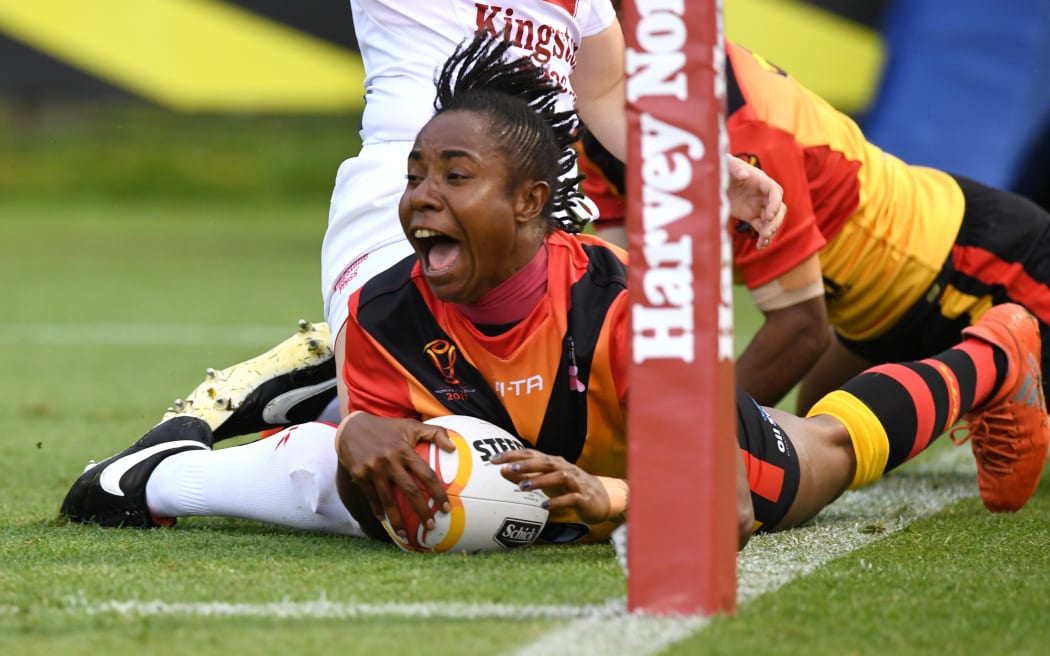 Naomi Kaupa scores the opening try of the match for PNG.
