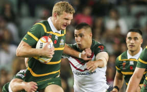 Tom Trbojevic looks to break a tackle. during Australia's 2017 World Cup match against Lebanon in Sydney..
