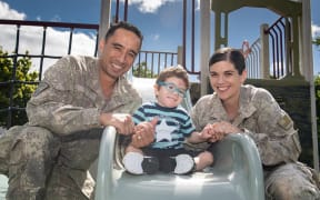 Captains Tane and Laura North with their son Elijah