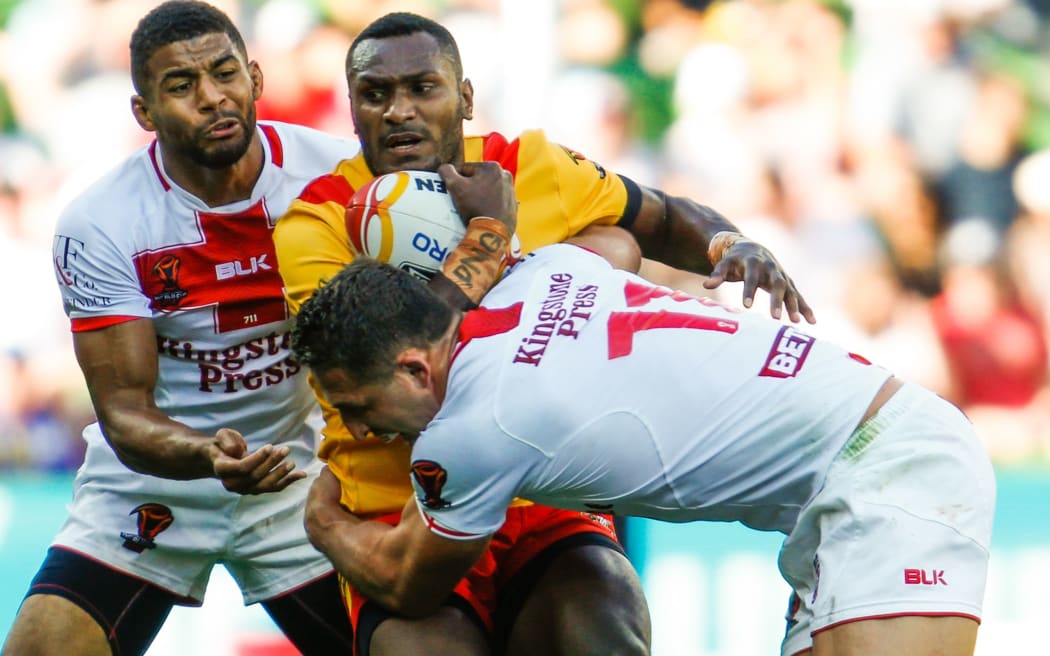 Kato Ottio is tackled during the England v PNG 2017 Rugby League World Cup Quarter Final