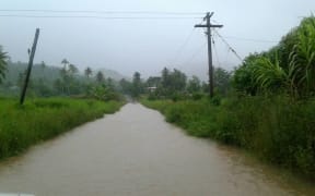 A road is closed because of flooding