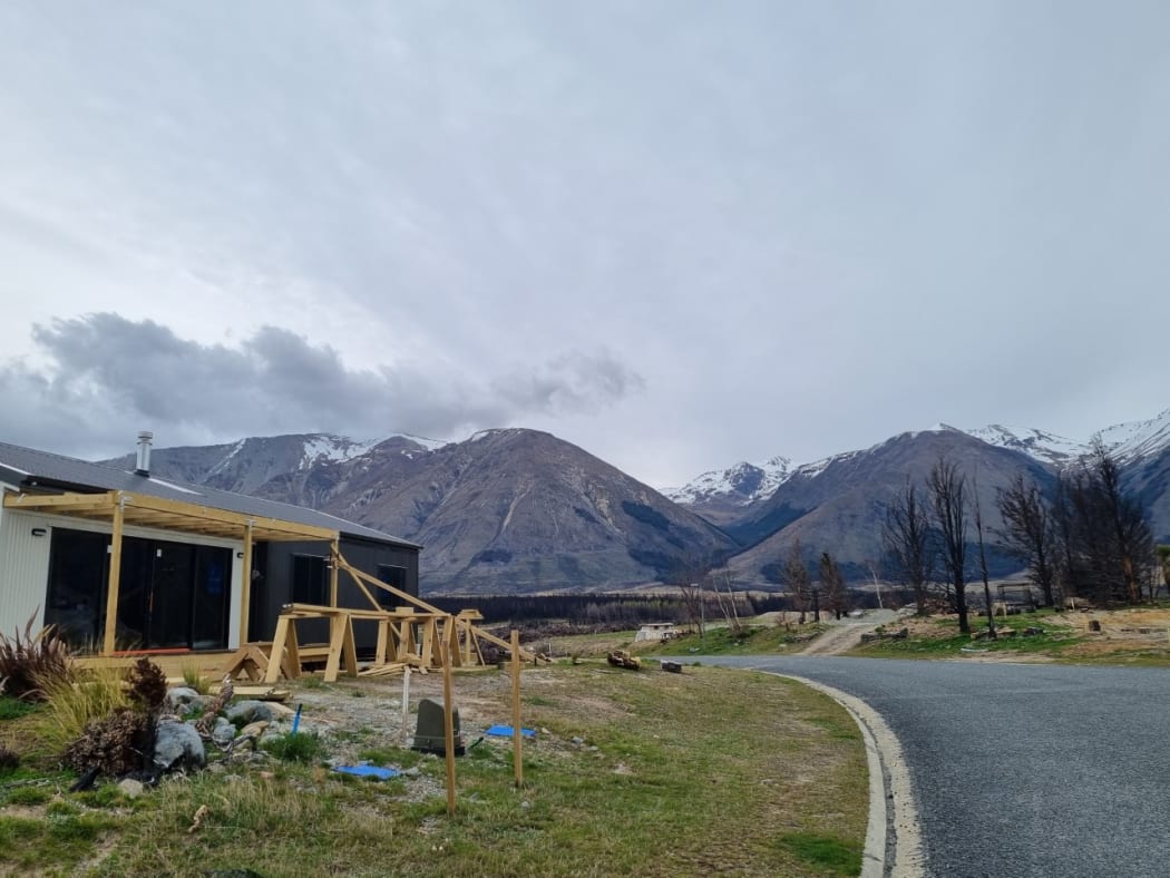 Rebuilding a year after the fire that swept through Lake Ōhau alpine village.