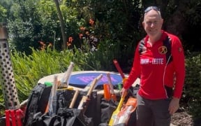 Mark Young with gear for Timor-Leste donated from Cricket Wellington