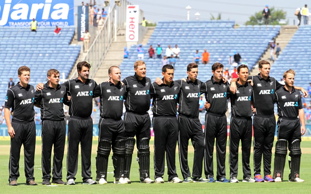 New Zealand Black Caps stand for the national anthem before the start of the match, India v New Zealand Black Caps. Second ODI, one day international cricket match in Pune, 2017.