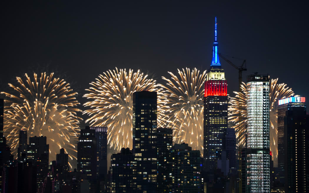 American Independence Day celebrated with Macy's 4th of July fireworks light up the sky next to the Empire State Building in New York City on July 4, 2023, as seen from Weehawken, New Jersey.
