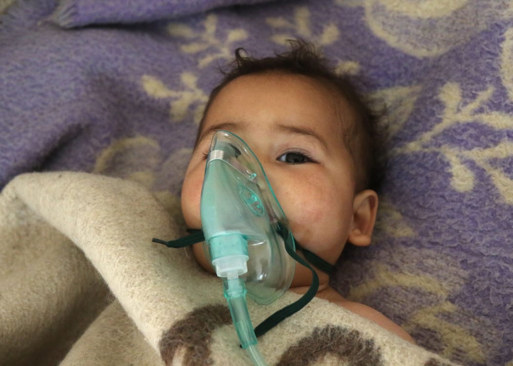 A Syrian child receives treatment at a small hospital in the town of Maaret al-Noman following a suspected toxic gas attack in Khan Sheikhun, a nearby rebel-held town in Syria’s northwestern Idlib province, on April 4, 2017.
