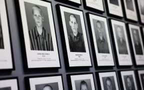 Portraits of prisoners are seen at the former Nazi German concentration camp Auschwitz-Brikenau in Oswiecim, Poland on 21 January 2025. (Photo by Jakub Porzycki/NurPhoto) (Photo by Jakub Porzycki / NurPhoto / NurPhoto via AFP)