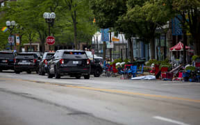 First responders work the scene of a shooting at a Fourth of July parade in Highland Park, Illinois, July 2022.
