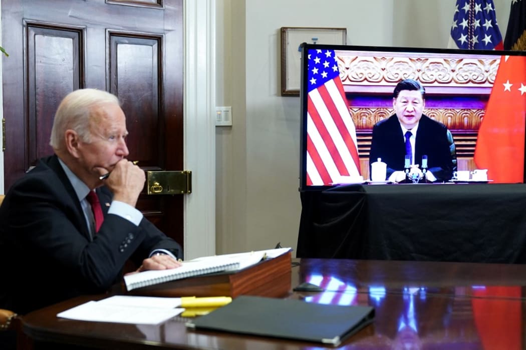 (FILES) In this file photo taken on November 15, 2021 US President Joe Biden meets with China's President Xi Jinping during a virtual summit from the Roosevelt Room of the White House in Washington, DC.