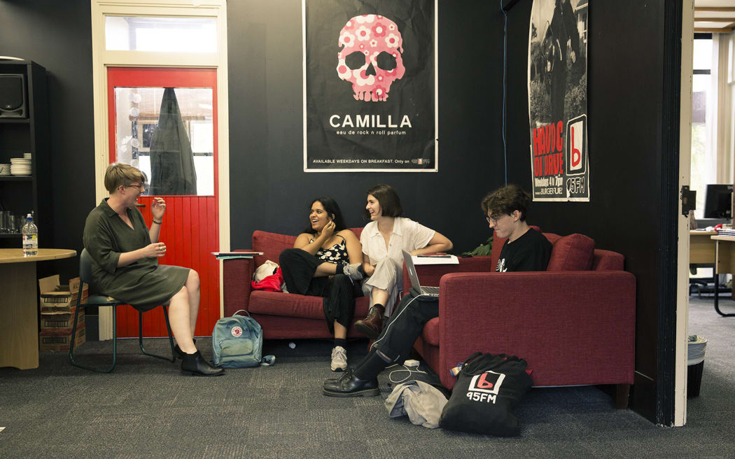 Caitlin McIlhagga (left) chats to volunteers in the bFM station office.