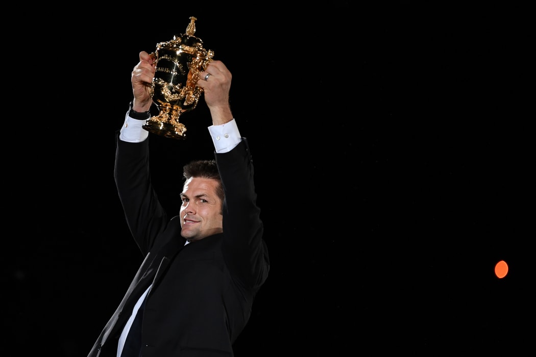 Former New Zealand international Richie McCaw holds the Rugby World Cup trophy during the tournament's opening ceremony at the Tokyo Stadium in Tokyo on September 20