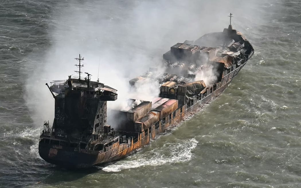 Smoke rises from the MV Solong cargo ship in the North Sea, off the coast of Withernsea, east of England, on March 11, 2025, after it collided with the MV Stena Immaculate tanker on March 10. Fires were raging on Tuesday after a the MV Solong, a cargo ship laden with toxic materials, crashed into the MV Immaculate, a tanker carrying flammable jet fuel in the North Sea, as questions mounted about how the accident happened. There were also growing fears that any spill from the collision could harm the local environment and coastline, home to seals, porpoises and some protected waders and waterfowl. (Photo by Paul ELLIS / AFP)