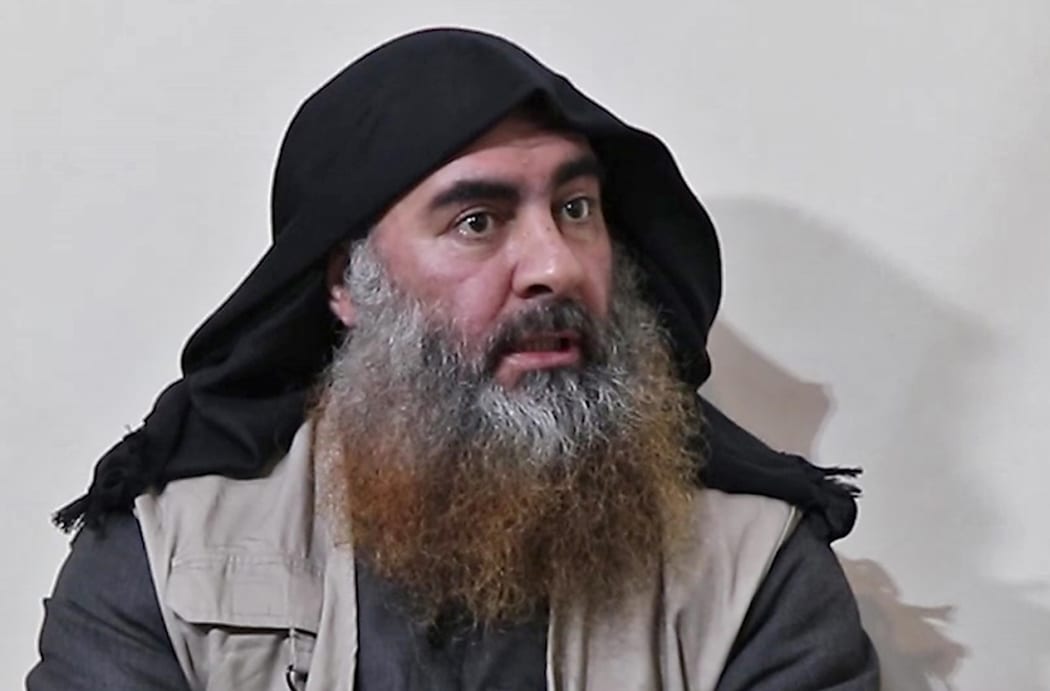 (FILES) In this file photo taken on April 30, 2019 In this undated tv grab taken from a video released by Al-Furqan media, the chief of the Islamic State group Abu Bakr al-Baghdadi purportedly appears for the first time in five years in a propaganda video in an undisclosed location.