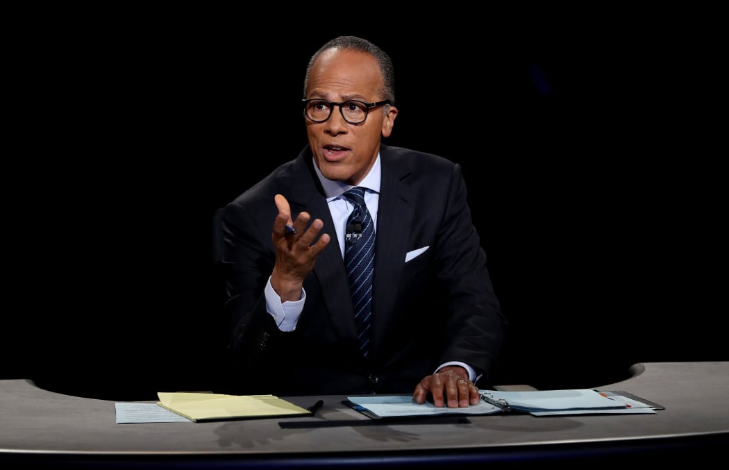Moderator Lester Holt listens during the Presidential Debate at Hofstra University on September 26, 2016 in Hempstead, New York.