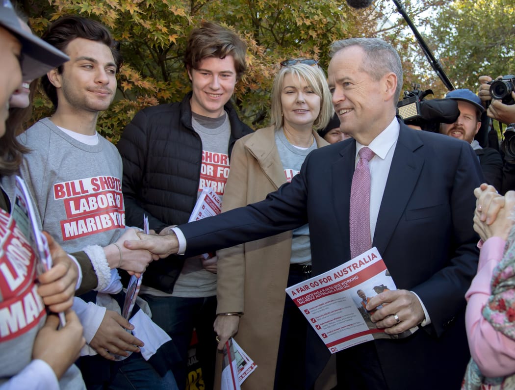 Australian Labor Party leader Bill Shorten, right, shakes hands with supporters at a polling station for a federal election in Melbourne, Australia, Saturday, May 18, 2019.