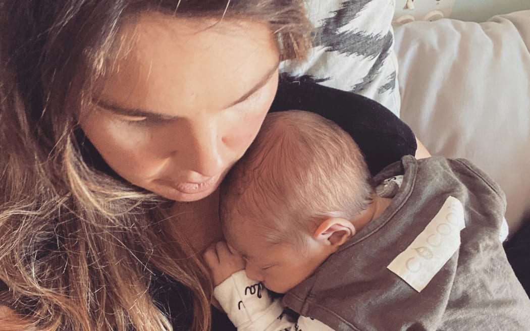 Musician Mel Parsons with one of her children