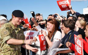 Prince Harry meets members of the public on his last official engagement before leaving Australia.