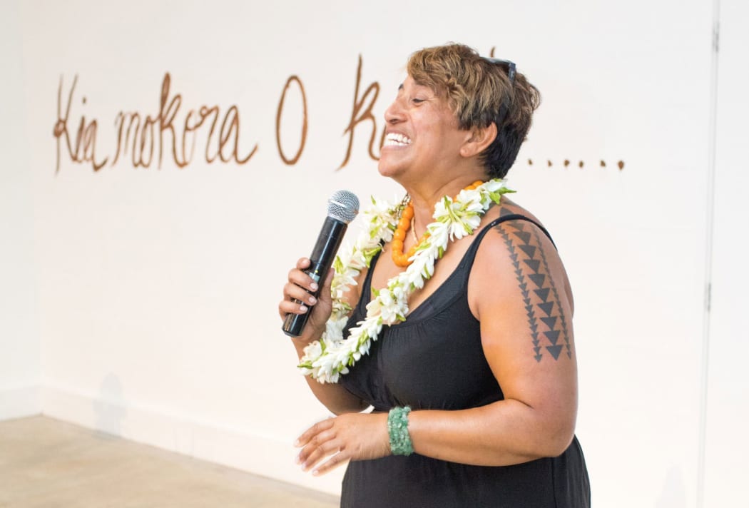 Artist NiaVal Ngaro speaks at the opening of her solo exhibition.