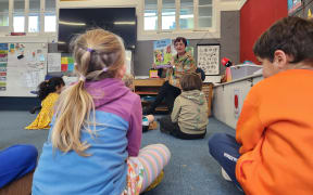 Te Aro School teacher Serah Mehrtens reads 'At the Marae' to her class. She says her pupils have not struggled with Māori words in the book.