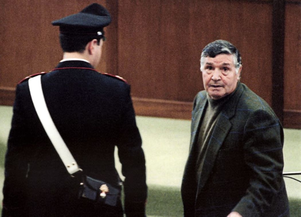 A 1993 picture shows mafia boss Salvatore "Toto" Riina during his trial at the high security prison Ucciardone in Palermo.