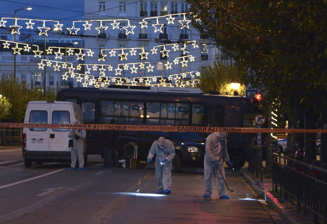Attackers on a motorcycle have thrown what is believed to be a grenade at the French embassy in the Greek capital, Athens.