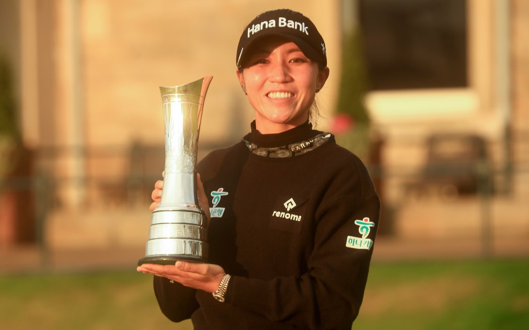 Lydia Ko of New Zealand with the Womens Open trophy in front of the R&A clubhouse, St Andrews, 2024.