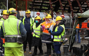 Families arrive at the mine.