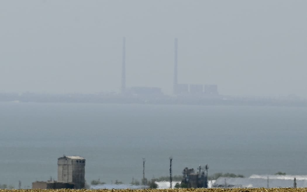 Concerns are increasing over attacks in and around the Zaporizhzhia nuclear power plant, seen here across the Dnipro river.