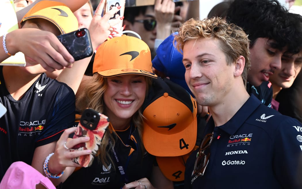 Liam Lawson of Red Bull Racing greets fan on arrival at the Albert Park Circuit in Melbourne, Victoria, Friday, March 14, 2025. (AAP Image/Joel Carrett / Photosport) NO ARCHIVING