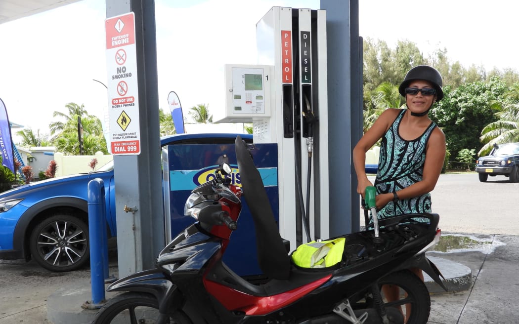 One of the commuters filling up her bike at OASIS yesterday when she heard that the fuel price will increase today. TALAIA MIKA/26032616